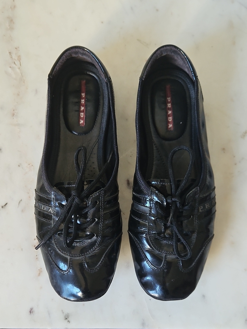 PRADA: Y2k Black Patent Leather Women’s Lace Logi Flats